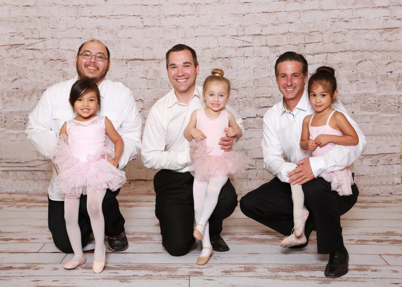 ballet dancing children with their fathers