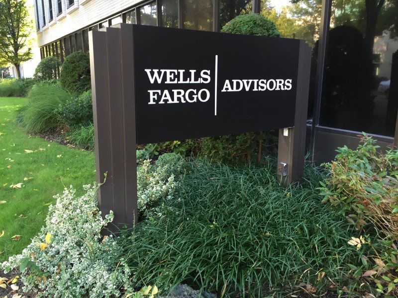 Mineola Monument Pylon Signs
A modern metal panel monument sign with a minimalist design and custom branding, located at the entrance of a corporate office.
This metal panel monument sign is a sleek and durable signage solution, perfect for corporate