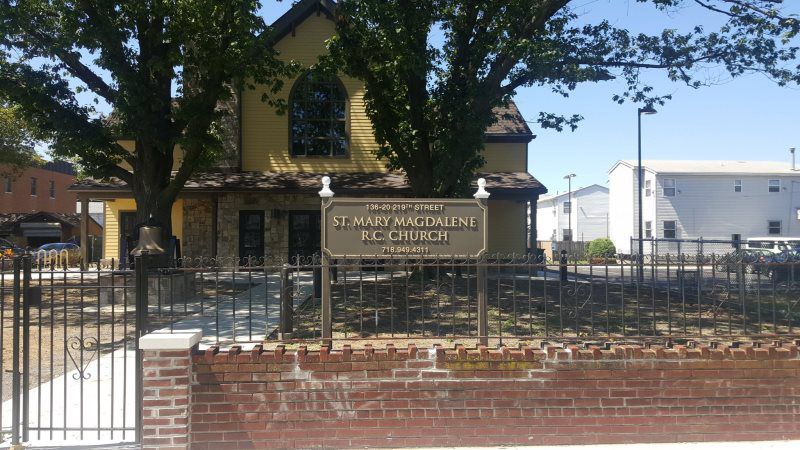 Mineola Monument Pylon Signs
A traditional church sign with engraved white lettering on a dark background, mounted on a metal post structure near the entrance.
The St. Mary Magdalene church sign is a beautifully crafted example of traditional church 