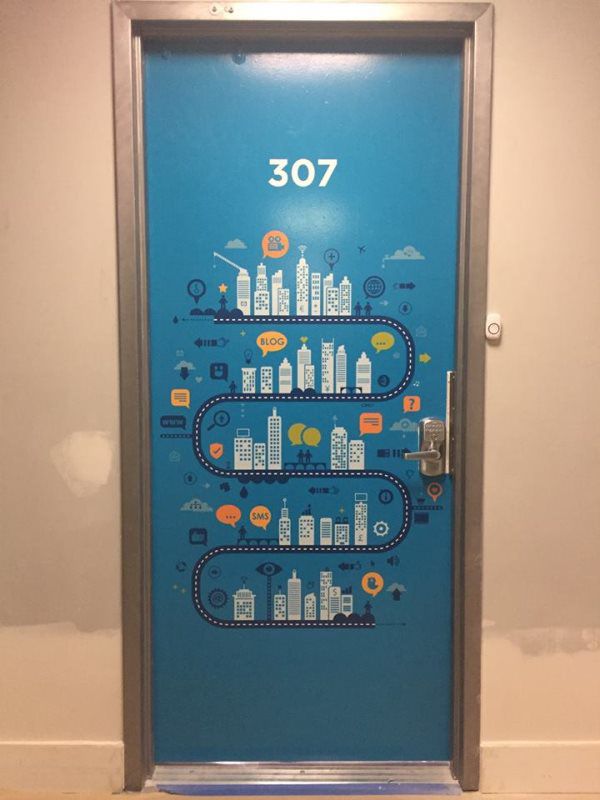 Stylish vinyl door wraps near me. Transform the entrance to your business with high-quality vinyl door wraps near me, created by Mineola Signs and Awnings. Vinyl door wraps provide a full-coverage solution, ideal for branding, decorative designs, or 