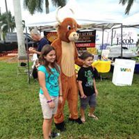 children with cow mascot